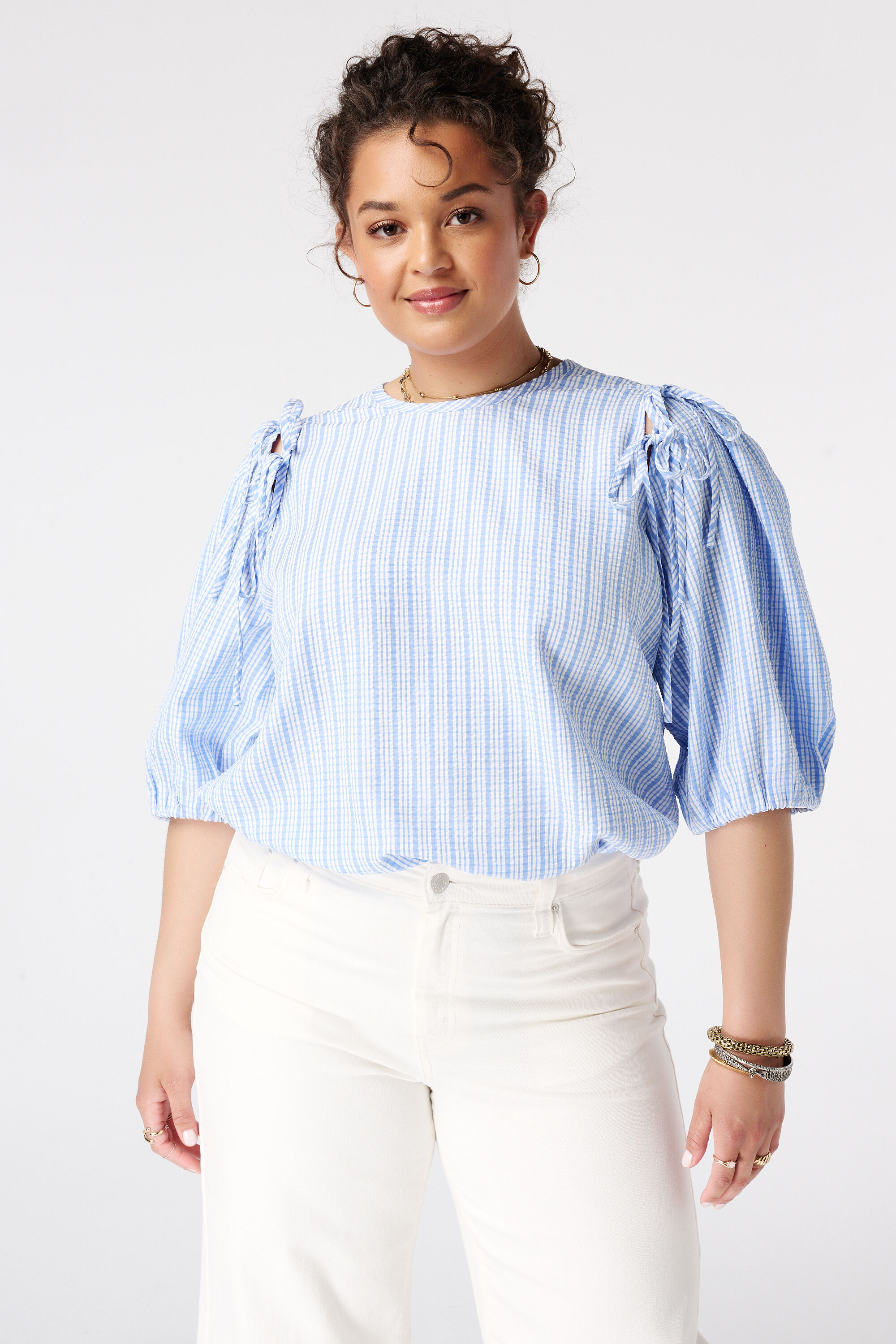 Blouse &agrave; carreaux avec manches bouffantes