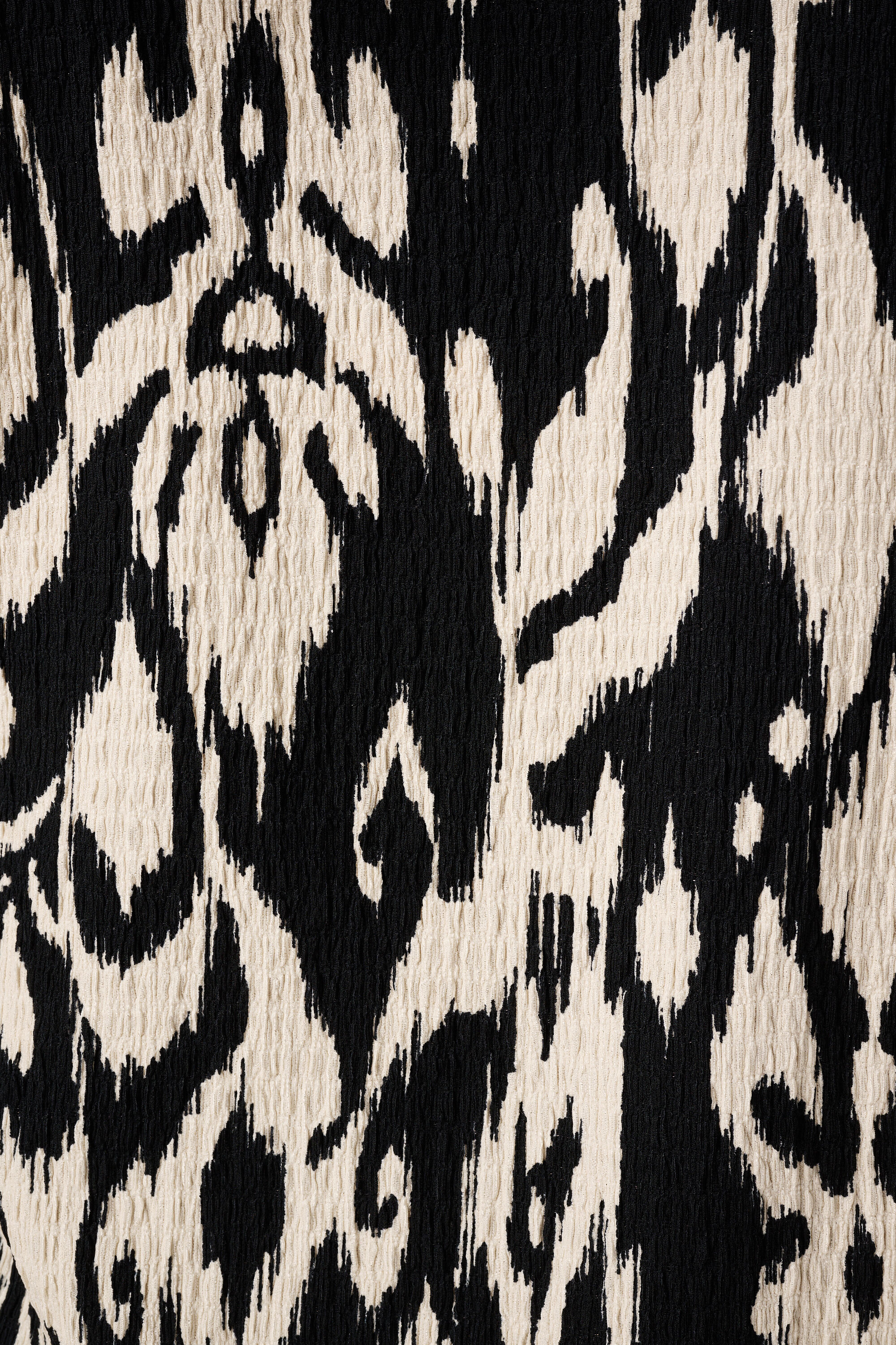 Haut textur&eacute; et mancherons image number 6