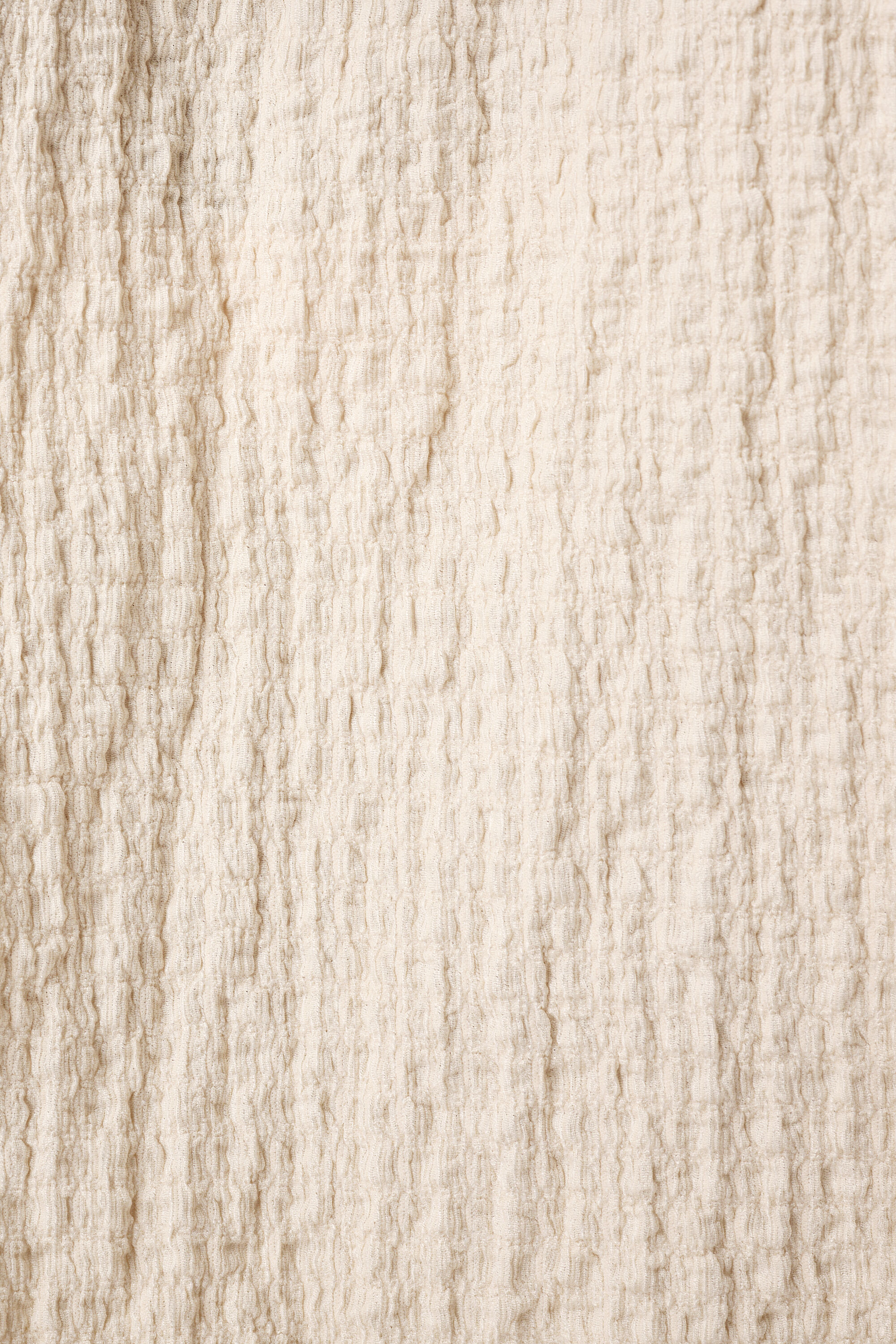 Haut textur&eacute; et mancherons image number 4