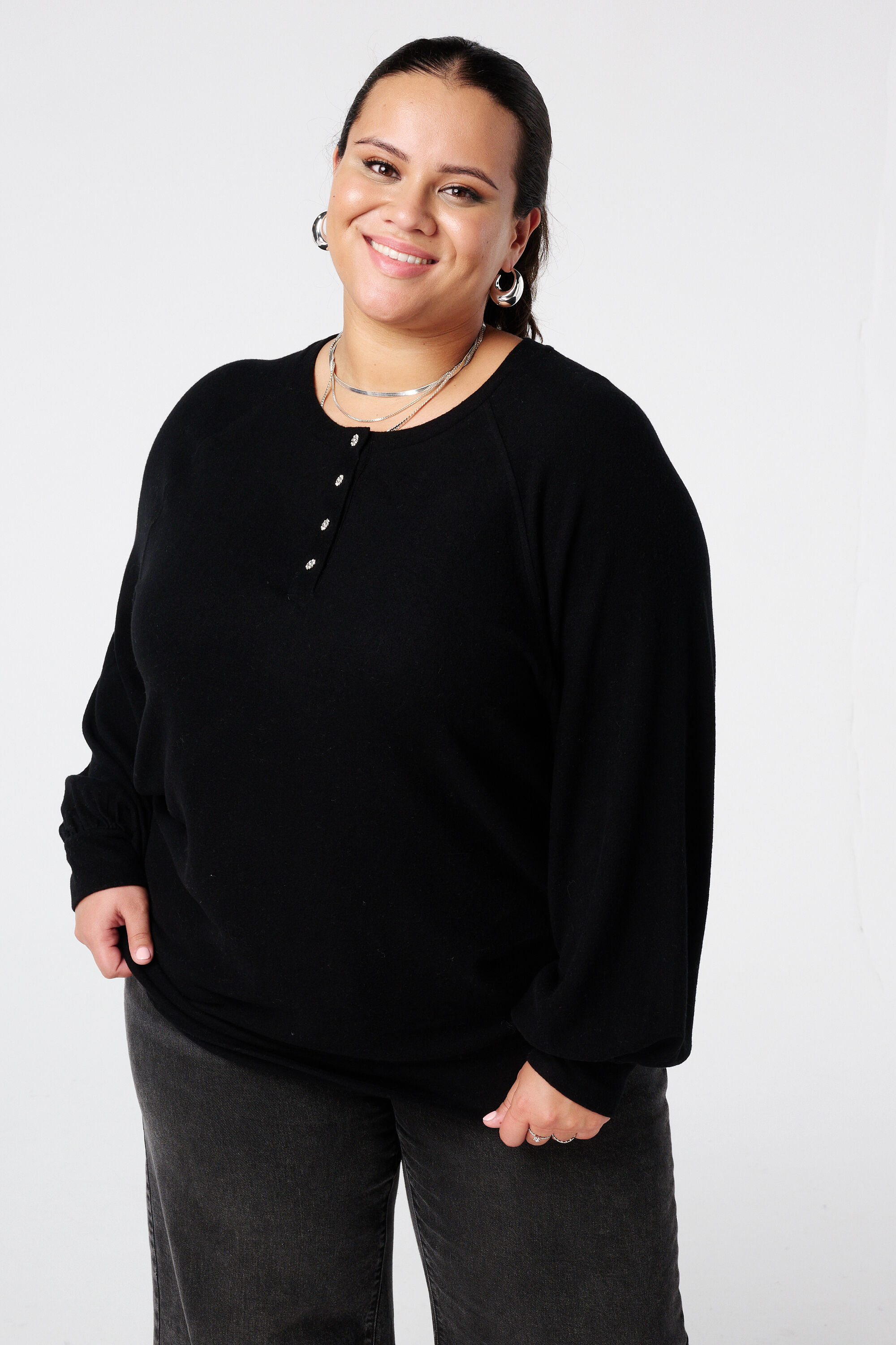 Pull en velours avec boutons strass